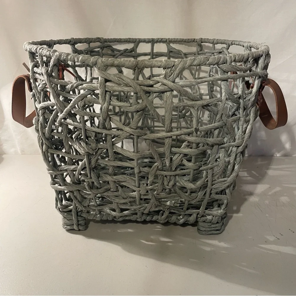 Woven gray Basket with brown Leather Handles width 14” deep 11” 4 metal feet